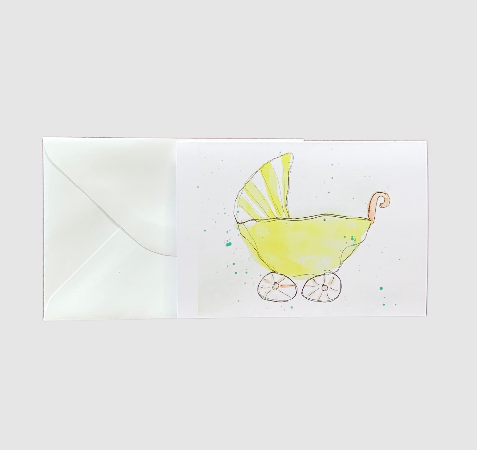 A sketch of a baby buggy painted with watercolors on the front of a greeting card.