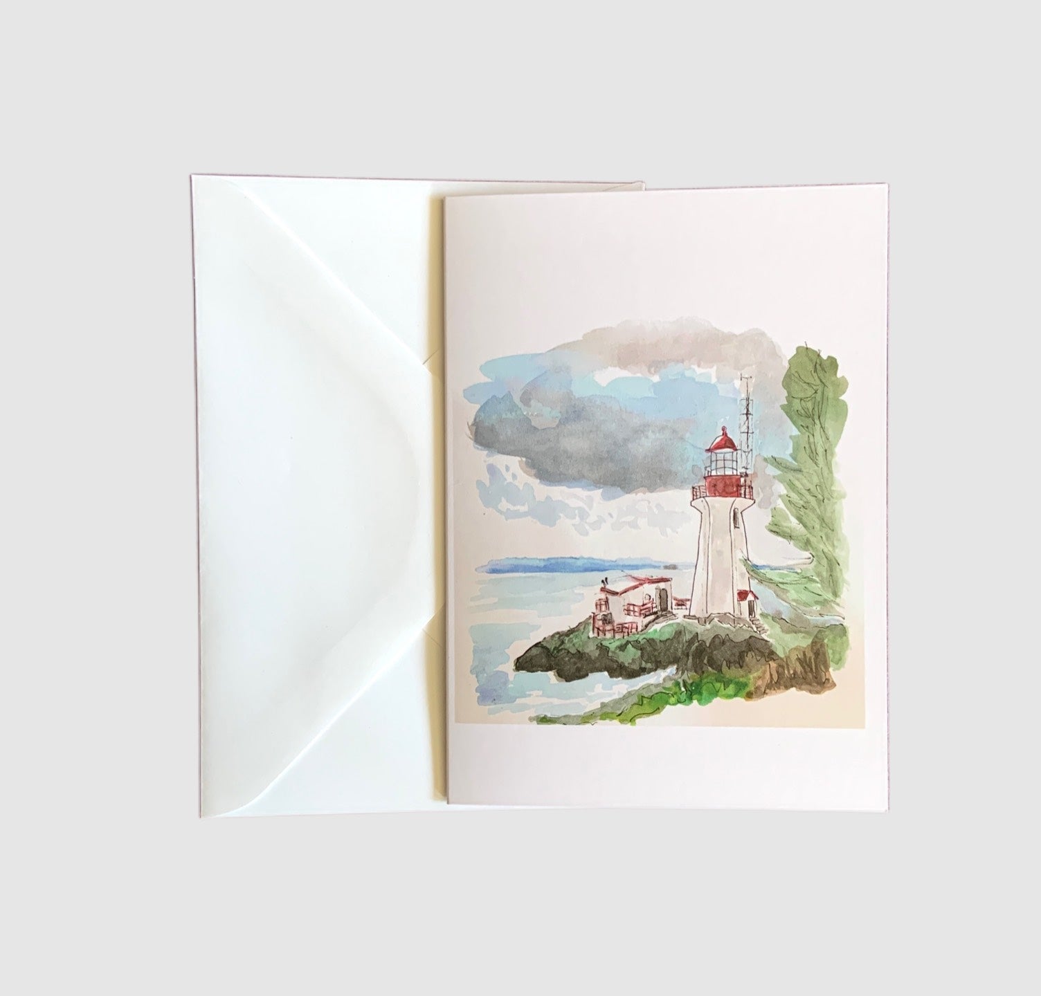 A sketch of the Sheringham Lighthouse painted with watercolors on the front of a greeting card.