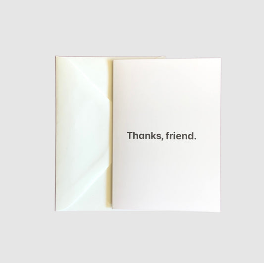 The words 'thanks, friend' on the front of a greeting card.
