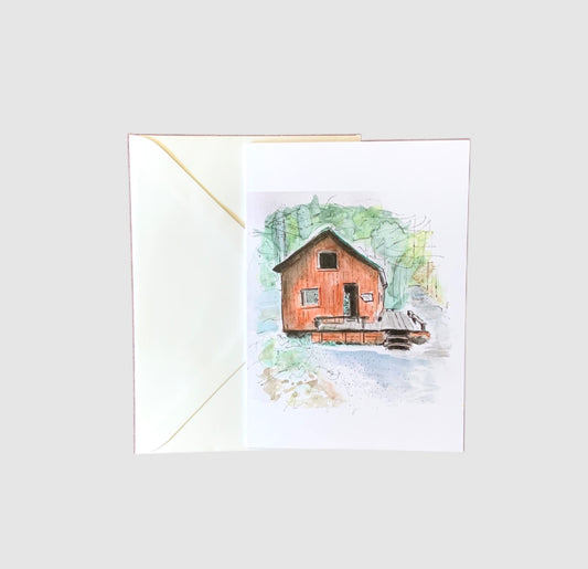 A sketch of a restored train station painted with watercolors on the front of a greeting card.