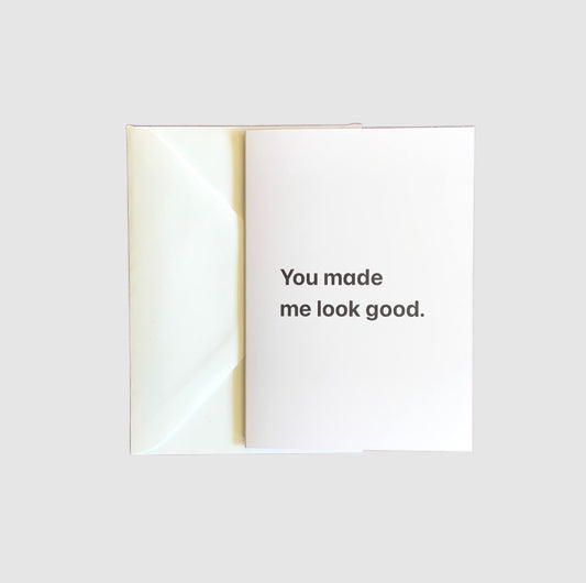 The words 'you made me look good' on the front of a greeting card.