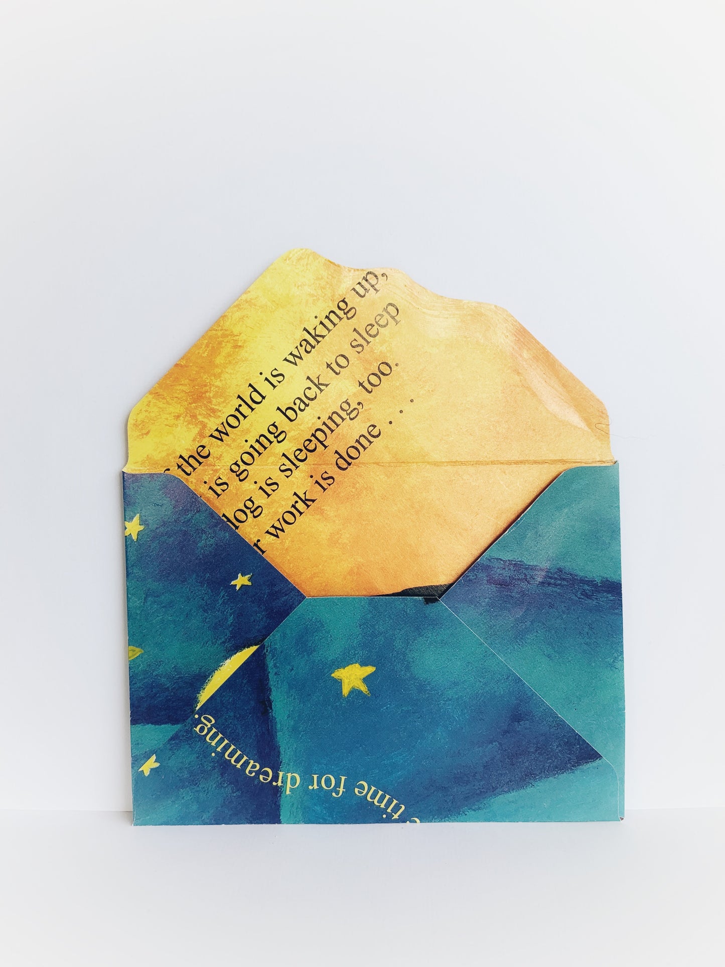 The back of an envelope with a star-filled sky