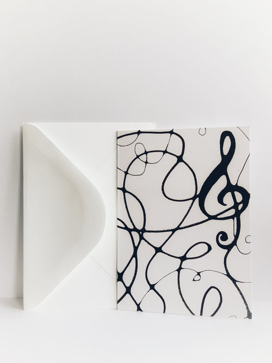 Greeting card with an image of intersecting black lines with a treble clef in neurographic art style